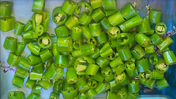 Prepare chilies for Hari Mirch ki Sabzi